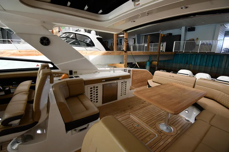  Yacht Photos Pics Luxurious interior of 2020 Sea Ray SLX 400 Outboard with elegant seating and wooden table.