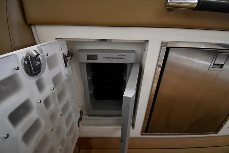  Yacht Photos Pics 2020 Sea Ray SLX 400 Outboard interior with open mini fridge and storage compartment.