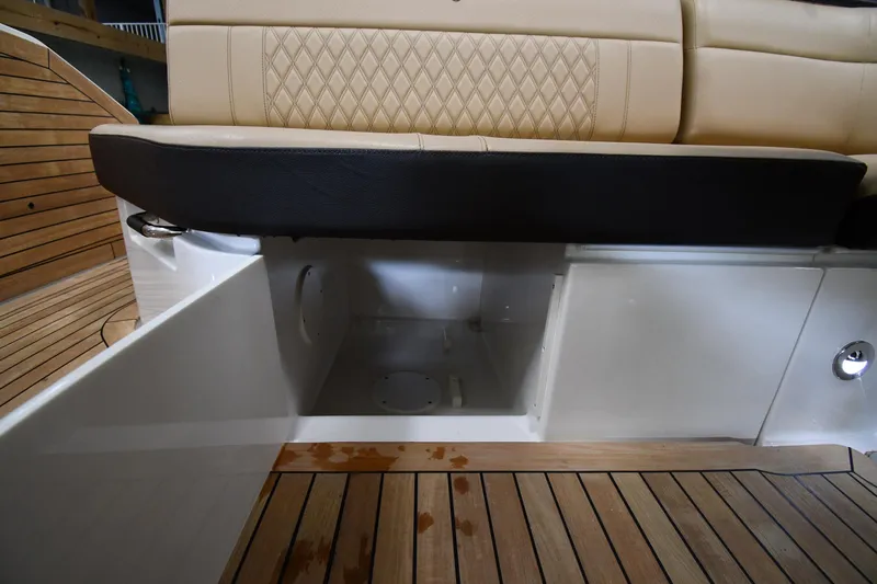  Yacht Photos Pics 2020 Sea Ray SLX 400 Outboard storage compartment with beige seating and wooden deck.