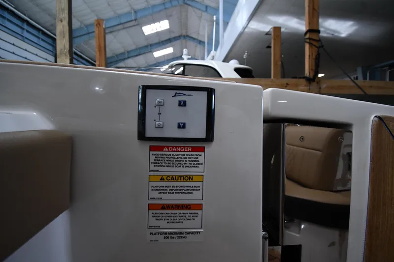  Yacht Photos Pics Control panel and safety warnings on a 2020 Sea Ray SLX 400 Outboard boat.