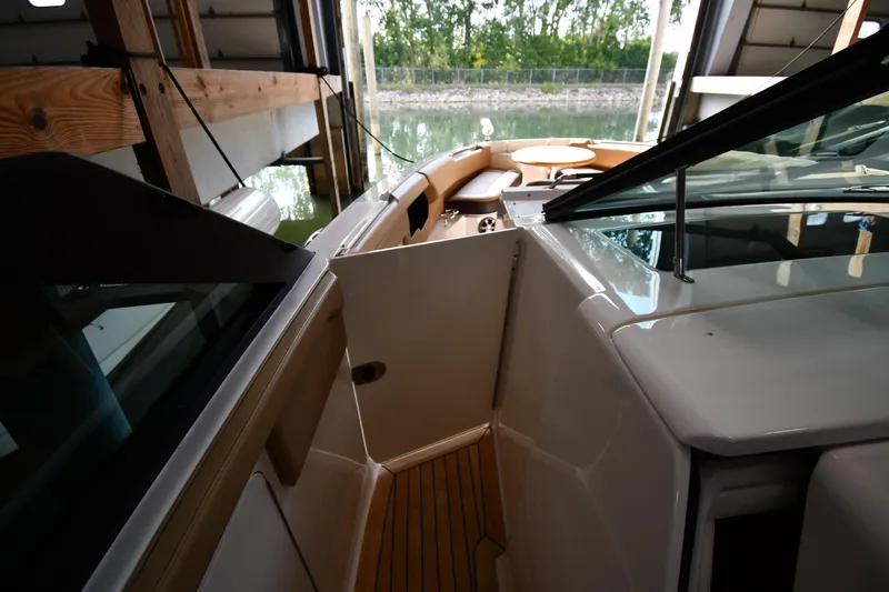  Yacht Photos Pics 2020 Sea Ray SLX 400 Outboard interior with open door, docked in a boathouse.