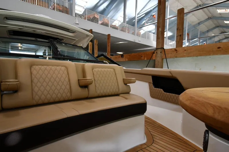  Yacht Photos Pics Luxurious interior of 2020 Sea Ray SLX 400 Outboard with tan leather seating and wood accents.