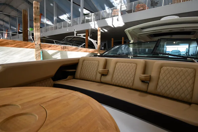  Yacht Photos Pics Luxurious interior of 2020 Sea Ray SLX 400 Outboard with tan seating and wooden table.
