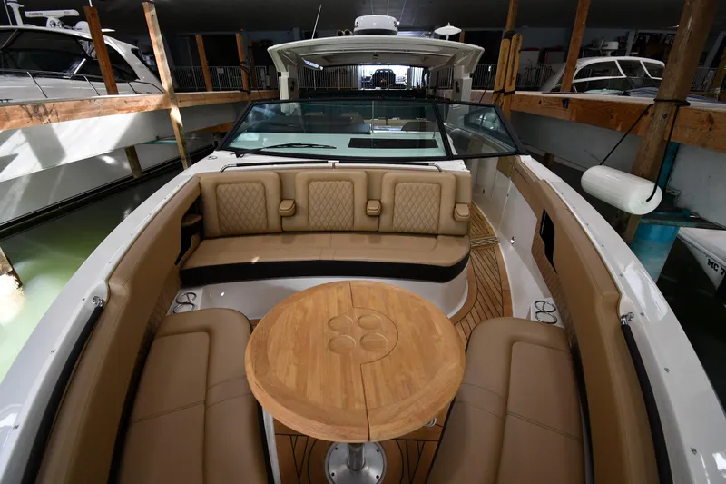  Yacht Photos Pics 2020 Sea Ray SLX 400 Outboard boat interior with tan seating and wooden table.