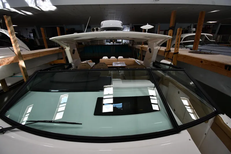  Yacht Photos Pics 2020 Sea Ray SLX 400 Outboard in indoor storage, showcasing sleek design and spacious interior.
