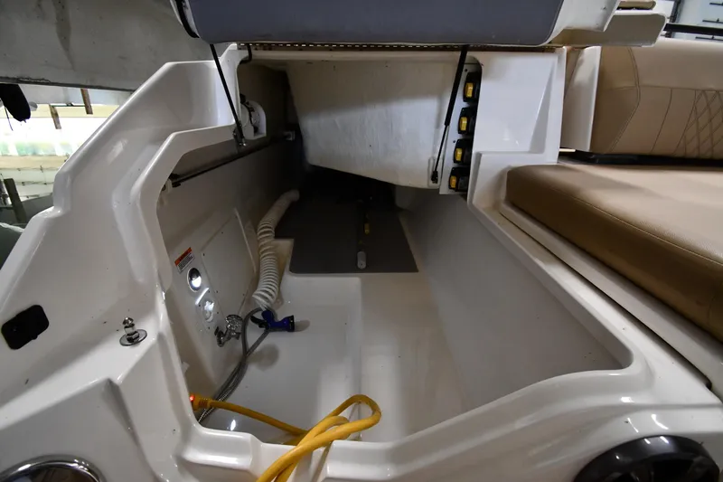  Yacht Photos Pics 2020 Sea Ray SLX 400 Outboard storage compartment with hoses and seating area.