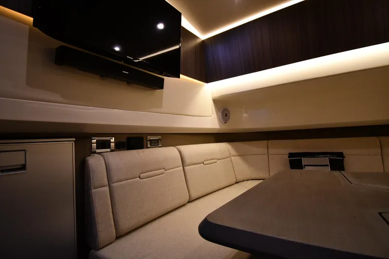  Yacht Photos Pics Luxurious interior of 2020 Sea Ray SLX 400 Outboard with plush seating and modern amenities.