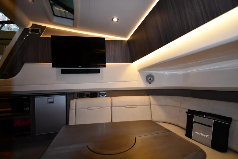 Yacht Photos Pics Luxurious interior of 2020 Sea Ray SLX 400 Outboard with seating, TV, and modern lighting.