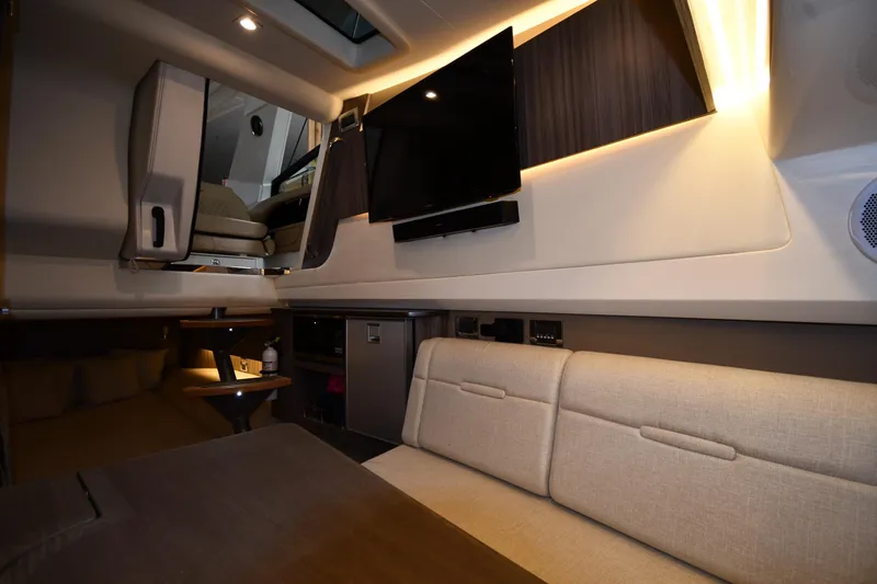  Yacht Photos Pics Luxurious interior of 2020 Sea Ray SLX 400 Outboard with modern seating and entertainment system.