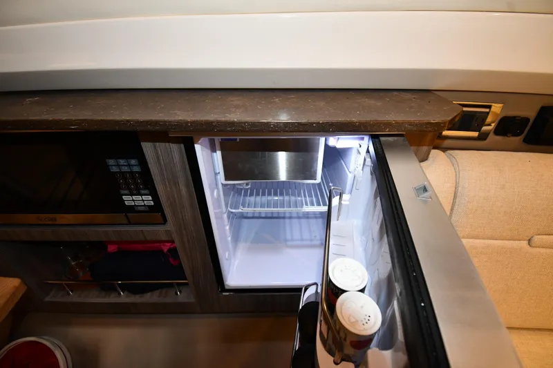  Yacht Photos Pics Interior of 2020 Sea Ray SLX 400 Outboard with open fridge and microwave.