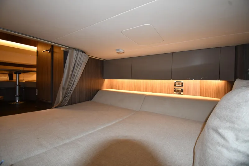 Yacht Photos Pics 2020 Sea Ray SLX 400 Outboard cabin interior with cozy bed and ambient lighting.