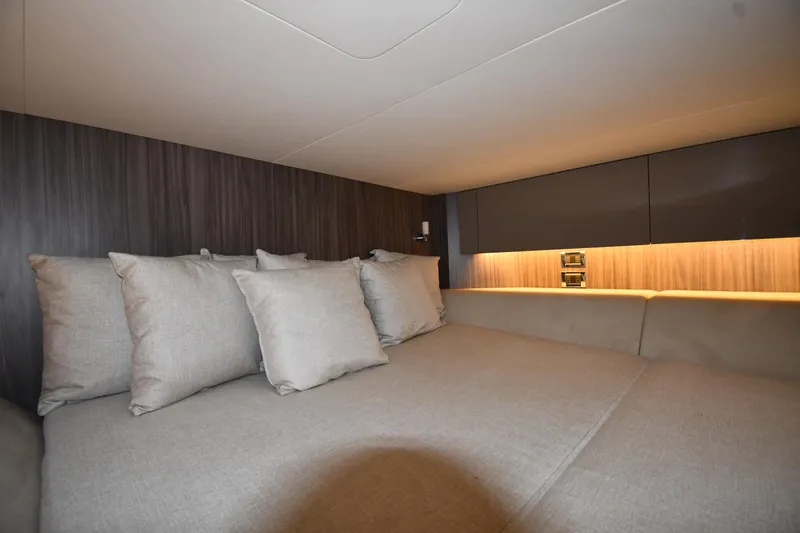  Yacht Photos Pics Luxurious cabin interior of 2020 Sea Ray SLX 400 Outboard with plush bedding and ambient lighting.