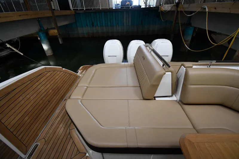  Yacht Photos Pics 2020 Sea Ray SLX 400 Outboard with tan seating and wooden deck in a marina.