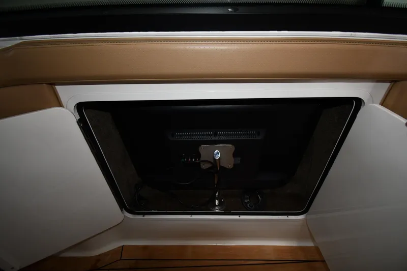  Yacht Photos Pics 2020 Sea Ray SLX 400 Outboard storage compartment with open door, showcasing interior details.