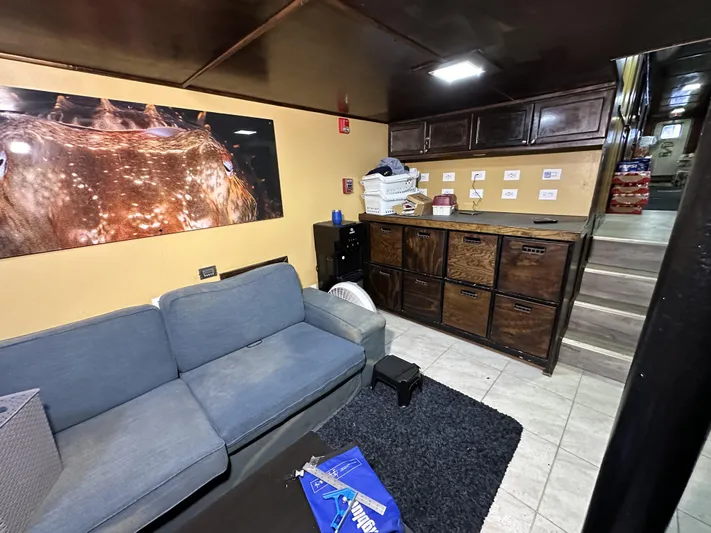 93' Dive Boat Yacht Photos Pics Interior of a 1965 custom dive boat with cozy seating and storage.