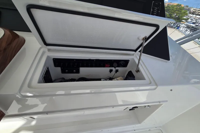 Covert Mission Yacht Photos Pics Open electrical panel on 1998 Viking 58 Convertible yacht, showcasing interior components.