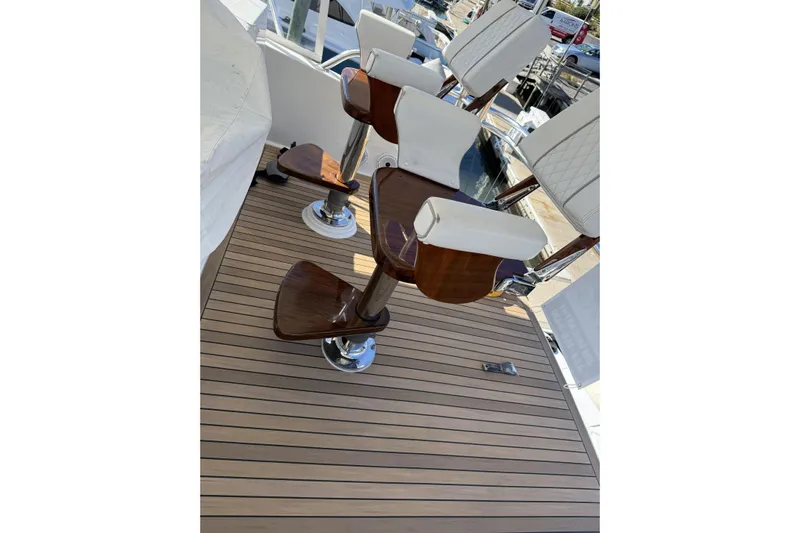 Covert Mission Yacht Photos Pics Luxury seating on 1998 Viking 58 Convertible yacht with wooden deck.