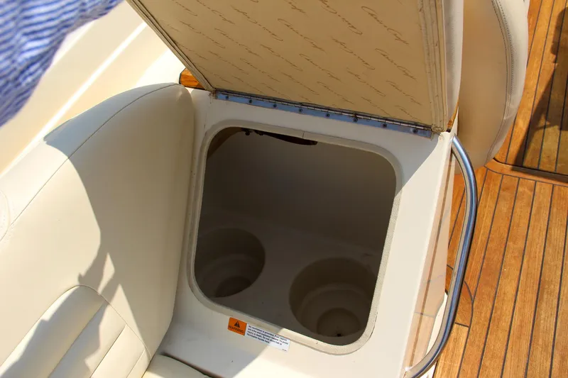 Wahoo Yacht Photos Pics Storage compartment in 2013 Chris-Craft Launch 28 boat with cup holders.