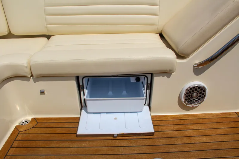 Wahoo Yacht Photos Pics 2013 Chris-Craft Launch 28 boat interior with storage compartment and cushioned seating.