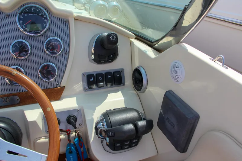 Wahoo Yacht Photos Pics 2013 Chris-Craft Launch 28 dashboard with gauges, controls, and steering wheel.
