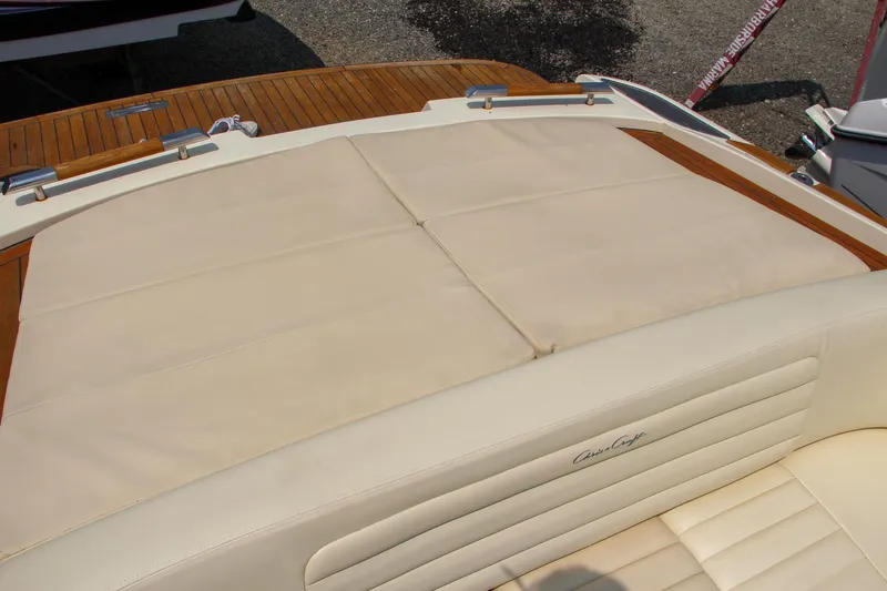 Wahoo Yacht Photos Pics 2013 Chris-Craft Launch 28 boat with beige leather seating and wooden deck.