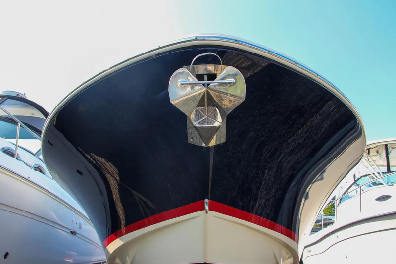 Wahoo Yacht Photos Pics 2013 Chris-Craft Launch 28 boat bow with anchor, docked between other boats.