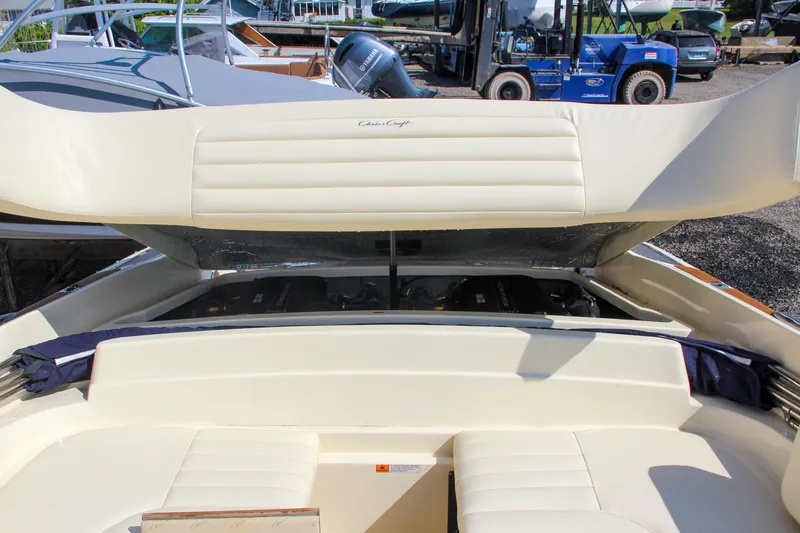 Wahoo Yacht Photos Pics 2013 Chris-Craft Launch 28 boat with open engine compartment and cream-colored seating.