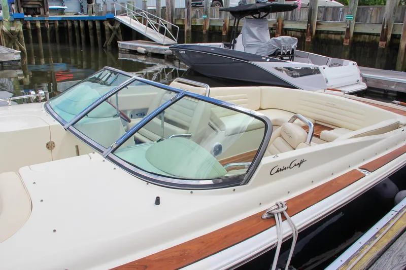 Wahoo Yacht Photos Pics 2013 Chris-Craft Launch 28 boat docked, featuring a sleek design and luxurious seating.