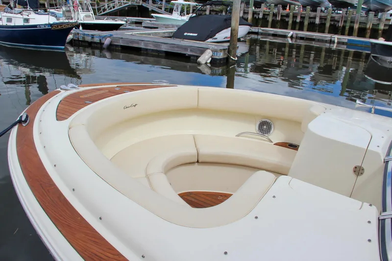 Wahoo Yacht Photos Pics 2013 Chris-Craft Launch 28 boat with spacious seating at a marina.