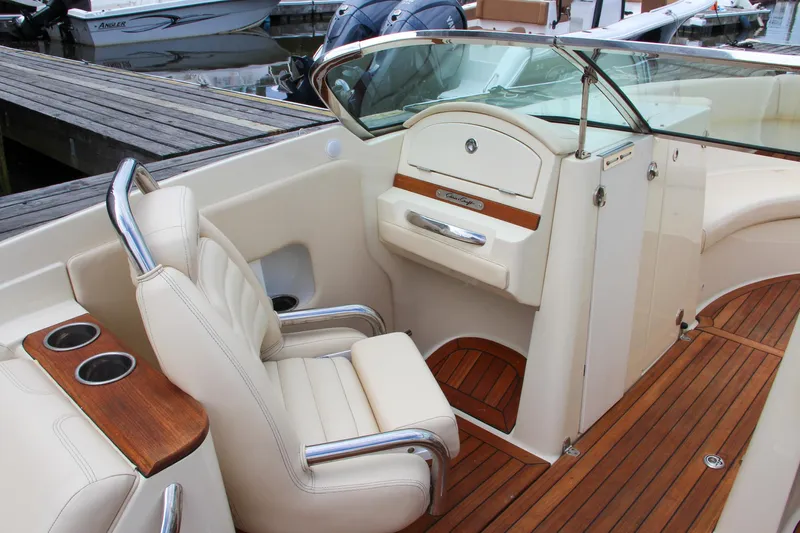 Wahoo Yacht Photos Pics 2013 Chris-Craft Launch 28 boat interior with beige seating and wooden accents.