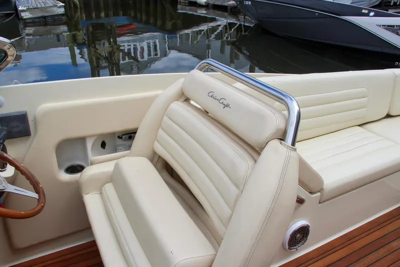 Wahoo Yacht Photos Pics 2013 Chris-Craft Launch 28 boat with beige leather seating and wooden deck.