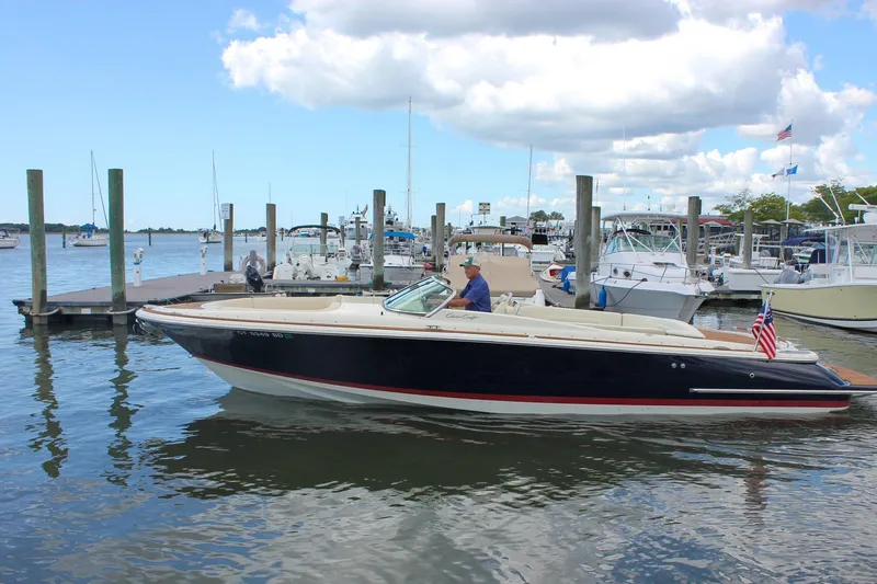 Wahoo Yacht Photos Pics 2013 Chris-Craft Launch 28 boat docked at marina under cloudy sky.