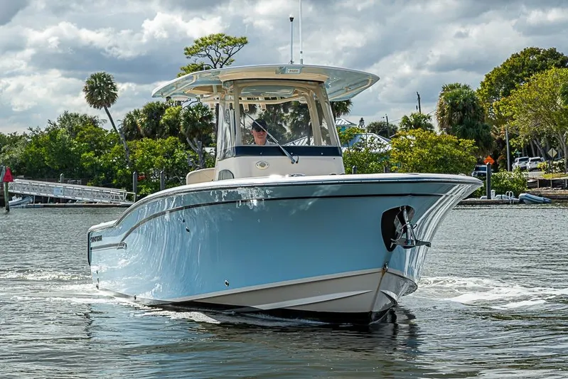 Little P Yacht Photos Pics 2016 Grady-White Canyon 271 FS boat cruising on a scenic waterway.