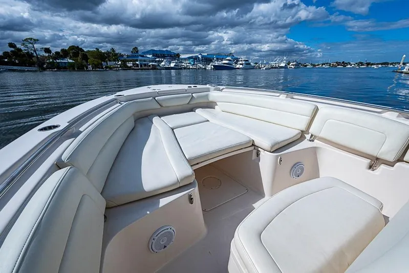 Little P Yacht Photos Pics 2016 Grady-White Canyon 271 FS boat with spacious seating, docked under cloudy skies.