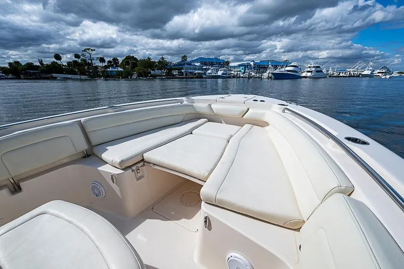Little P Yacht Photos Pics 2016 Grady-White Canyon 271 FS boat with spacious seating, docked under cloudy skies.