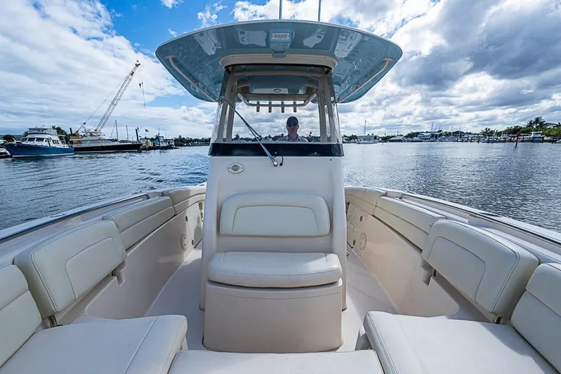 Little P Yacht Photos Pics 2016 Grady-White Canyon 271 FS boat on water, featuring spacious seating and helm.