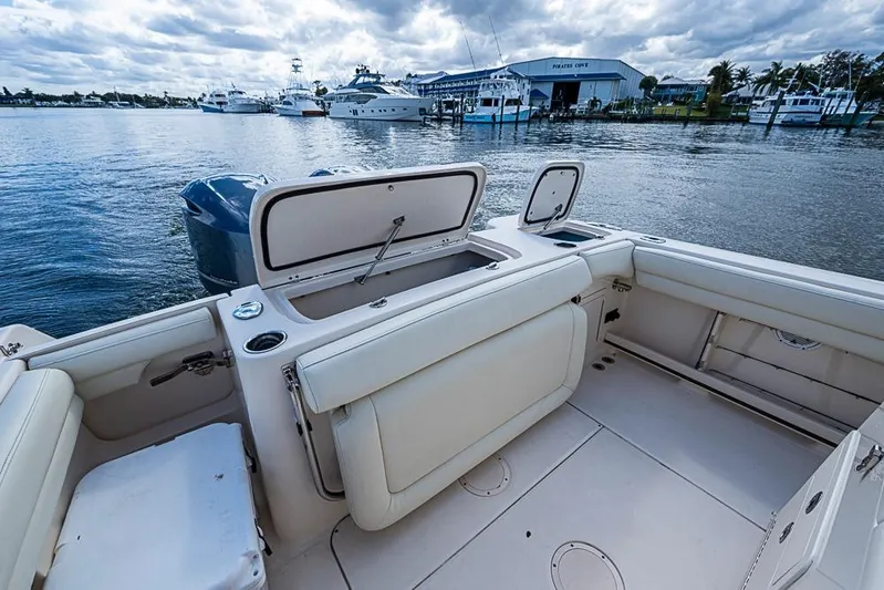 Little P Yacht Photos Pics 2016 Grady-White Canyon 271 FS boat interior with open storage, docked at marina.