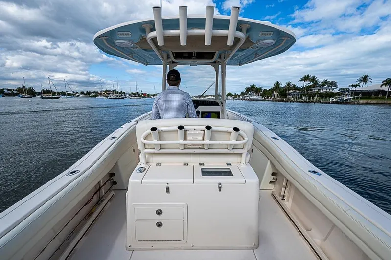 Little P Yacht Photos Pics 2016 Grady-White Canyon 271 FS boat cruising on a scenic waterway.