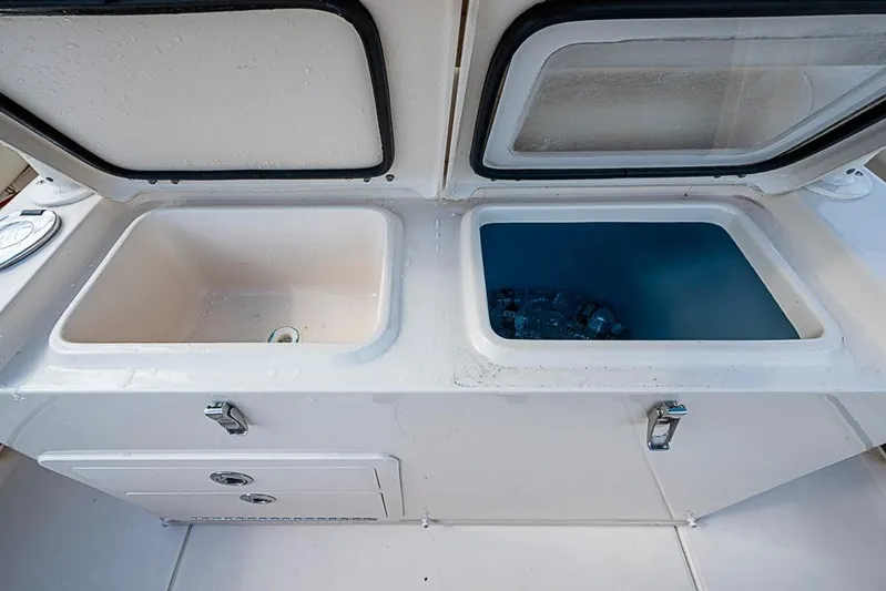 Little P Yacht Photos Pics 2016 Grady-White Canyon 271 FS boat storage compartments with open lids.