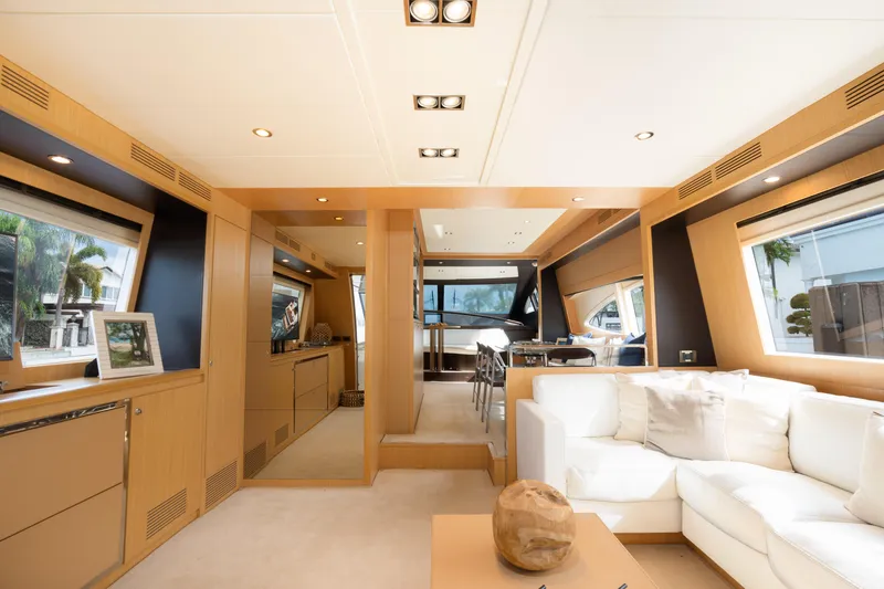  Yacht Photos Pics Luxurious interior of 2012 Riva 75 Venere yacht with modern furnishings and large windows.