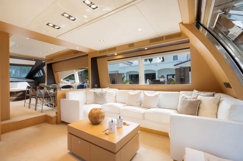  Yacht Photos Pics Luxurious interior of 2012 Riva 75 Venere yacht with white sofa and large windows.