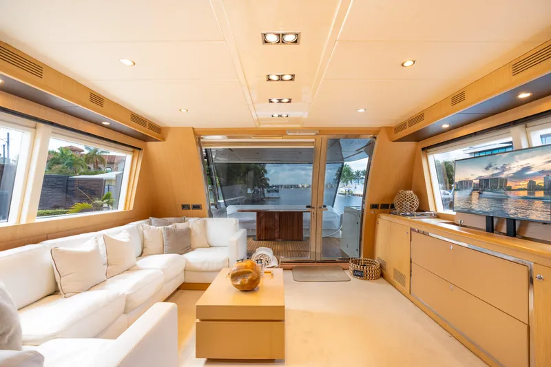  Yacht Photos Pics Luxurious interior of 2012 Riva 75 Venere yacht with modern furnishings and large windows.