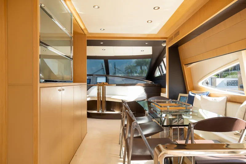  Yacht Photos Pics Luxurious interior of 2012 Riva 75 Venere yacht with modern dining area and large windows.