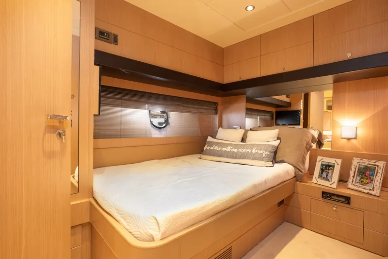  Yacht Photos Pics Luxurious bedroom interior of 2012 Riva 75 Venere yacht with modern wooden finish.