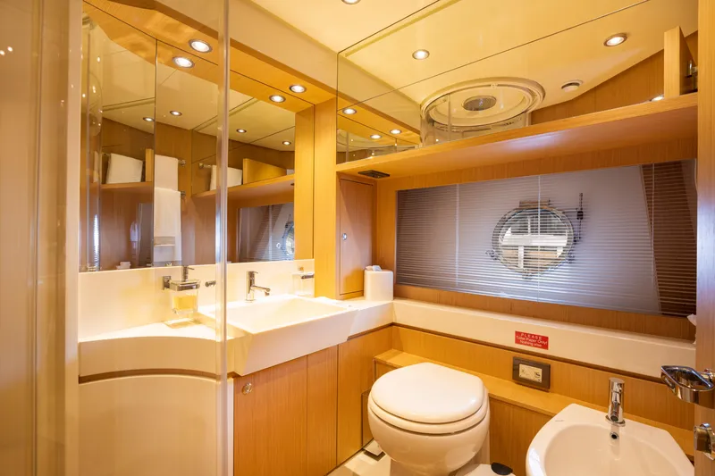  Yacht Photos Pics Luxurious bathroom on a 2012 Riva 75 Venere yacht with modern fixtures.