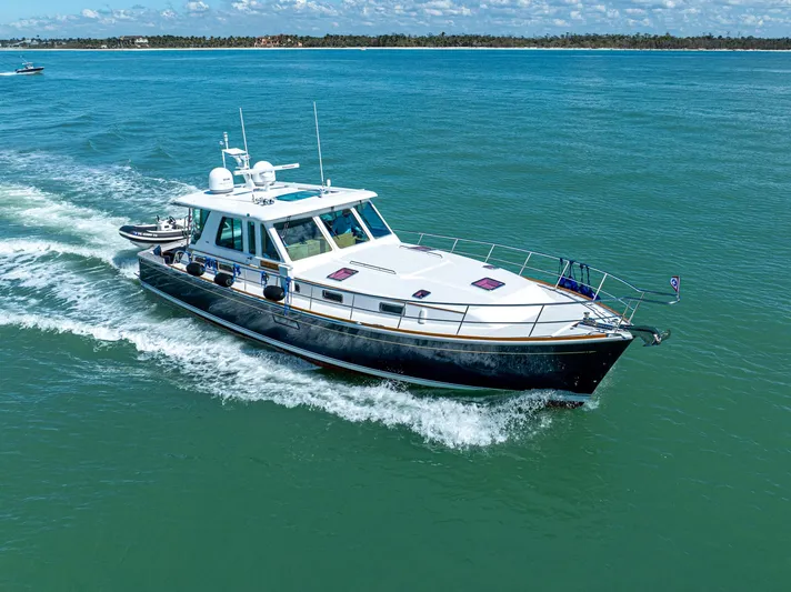  Yacht Photos Pics 2009 Sabre 52 Express yacht cruising on open water.