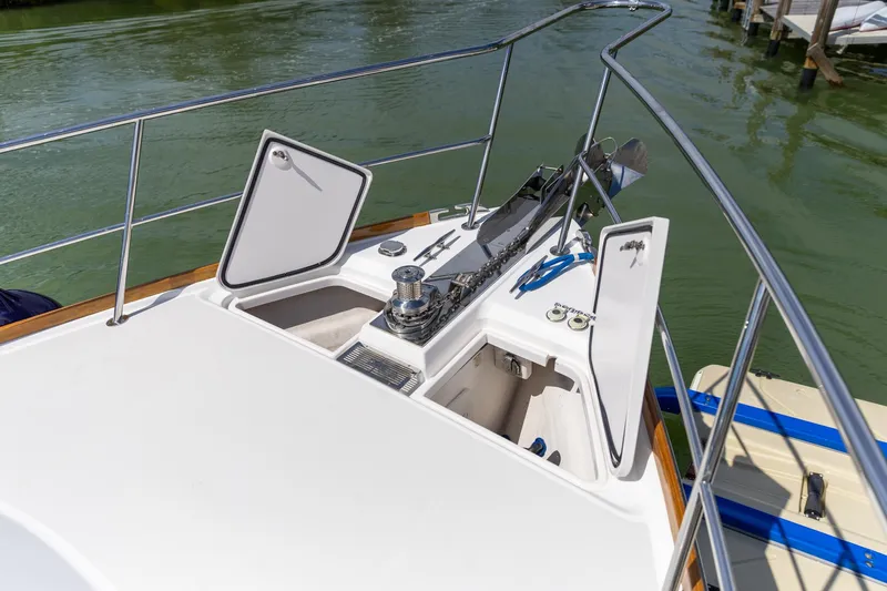  Yacht Photos Pics 2009 Sabre 52 Express yacht deck with open storage compartments and railing.