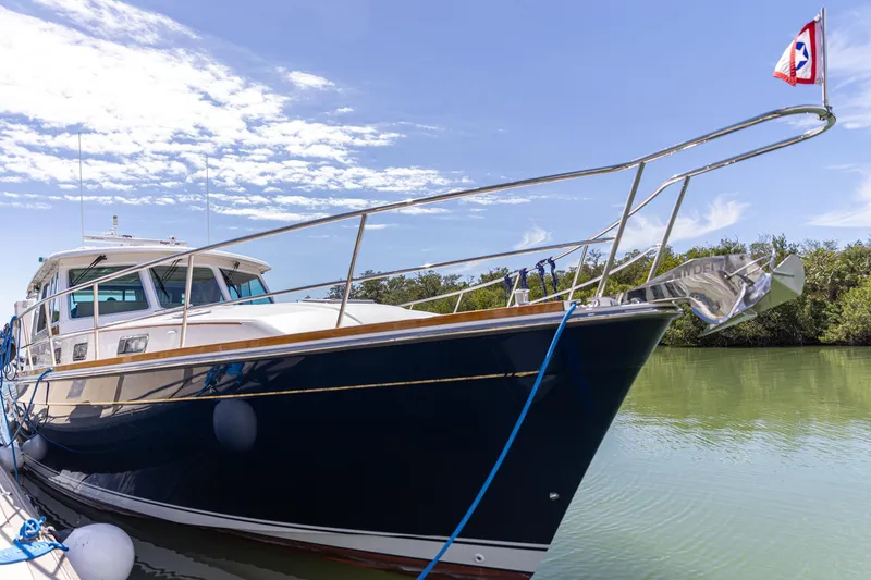  Yacht Photos Pics 2009 Sabre 52 Express yacht docked on a sunny day, featuring sleek design and blue hull.