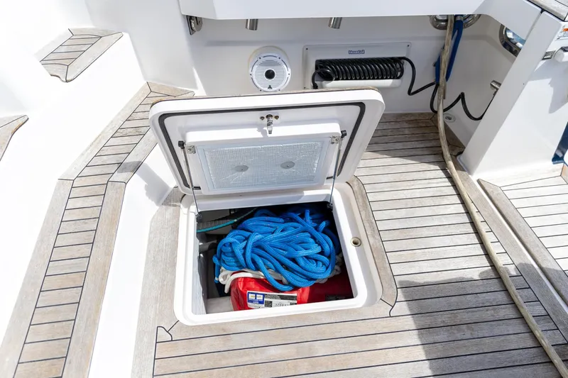  Yacht Photos Pics Open storage compartment on 2009 Sabre 52 Express yacht deck with blue rope.