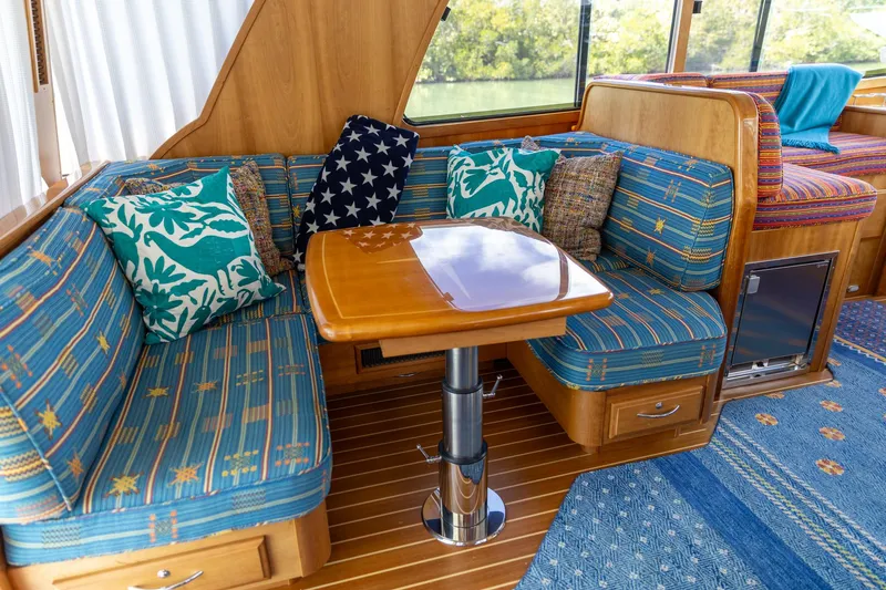  Yacht Photos Pics Interior of 2009 Sabre 52 Express yacht with cozy seating and decorative cushions.